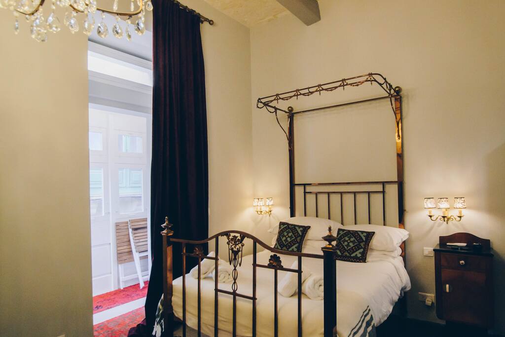 Comfortable Double Bed with Traditional Maltese Balcony