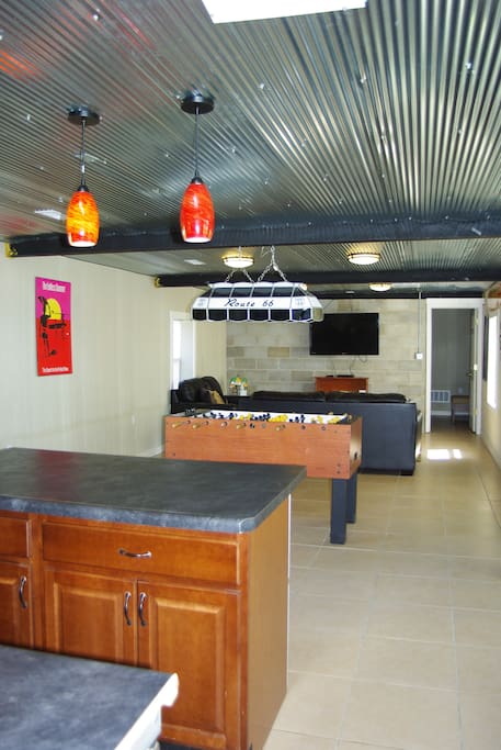 Kitchenette/Living Room area with sofa/sleeper and foosball table, River Veiw Guest House