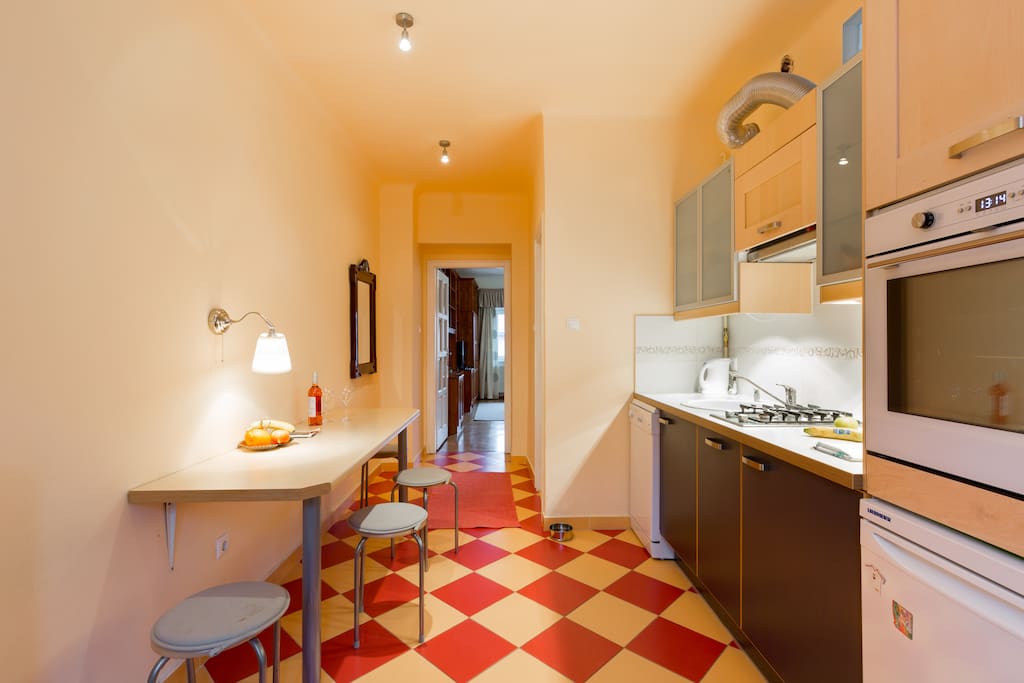 This is what you see when you arrive: the kitchen of the apartment. The bedroom to the right, bathroom straight and right, living room straight ahead :)