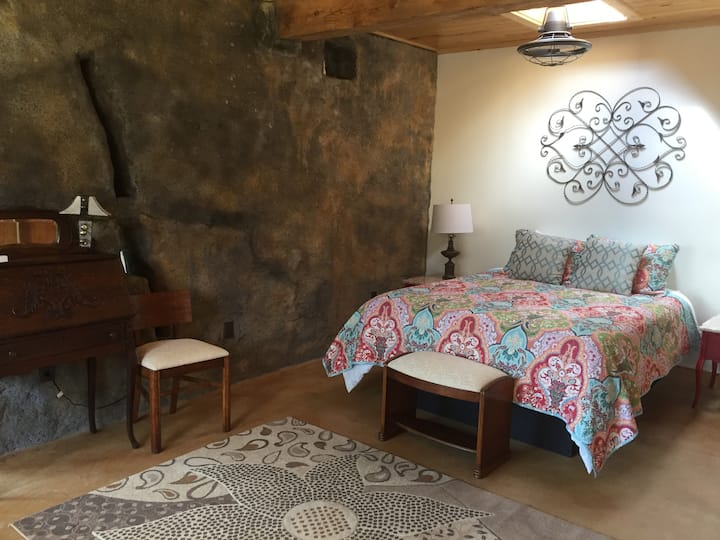 Both beds have fans over them.