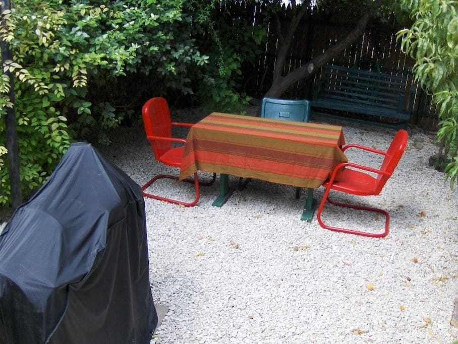 Backyard courtyard area with charcoal BBQ