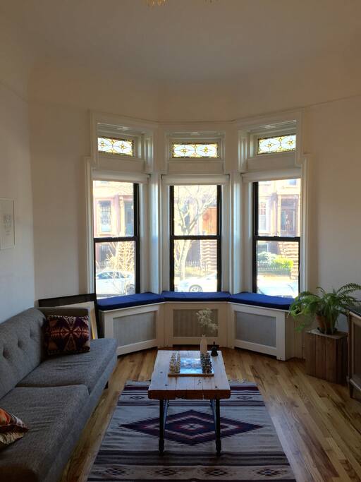 Bay windows in front and back of apartment give plenty of natural light