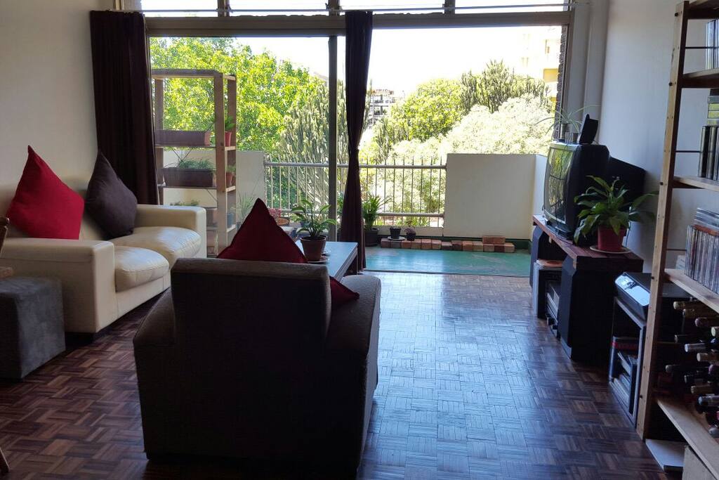 Lovely view in a light and airy lounge, glass sliding door onto the balcony.