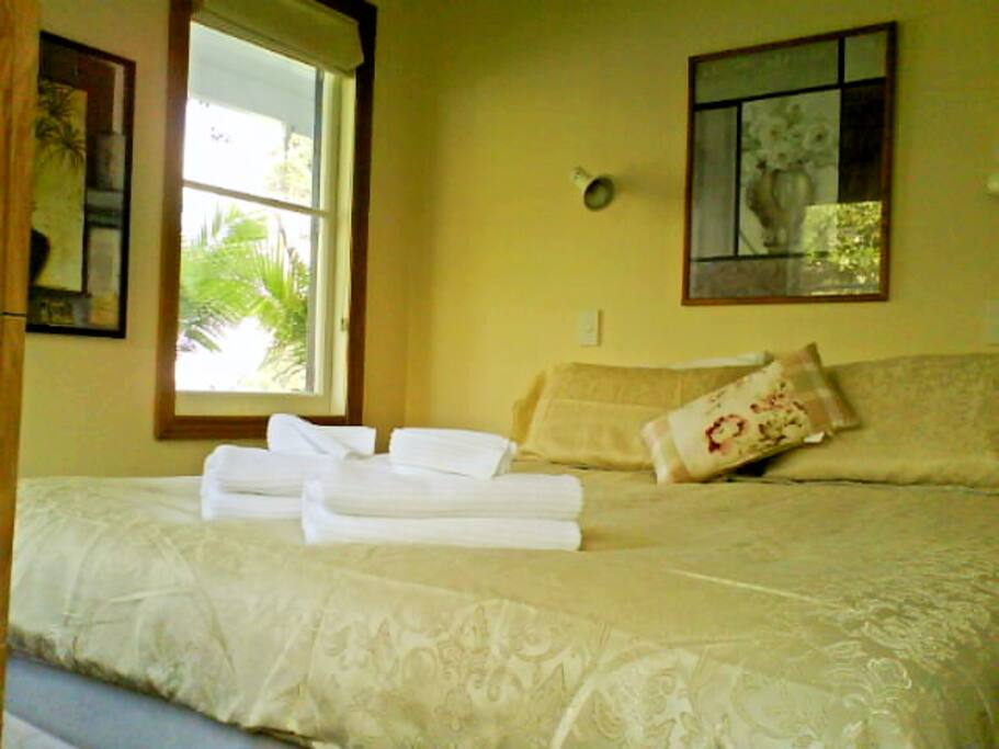 Master bedroom with king bed and views of the waterfront