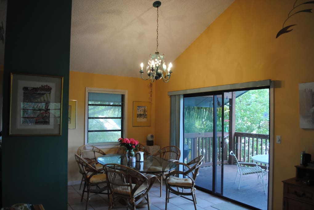 Dining room with view of the front porch through glass door.