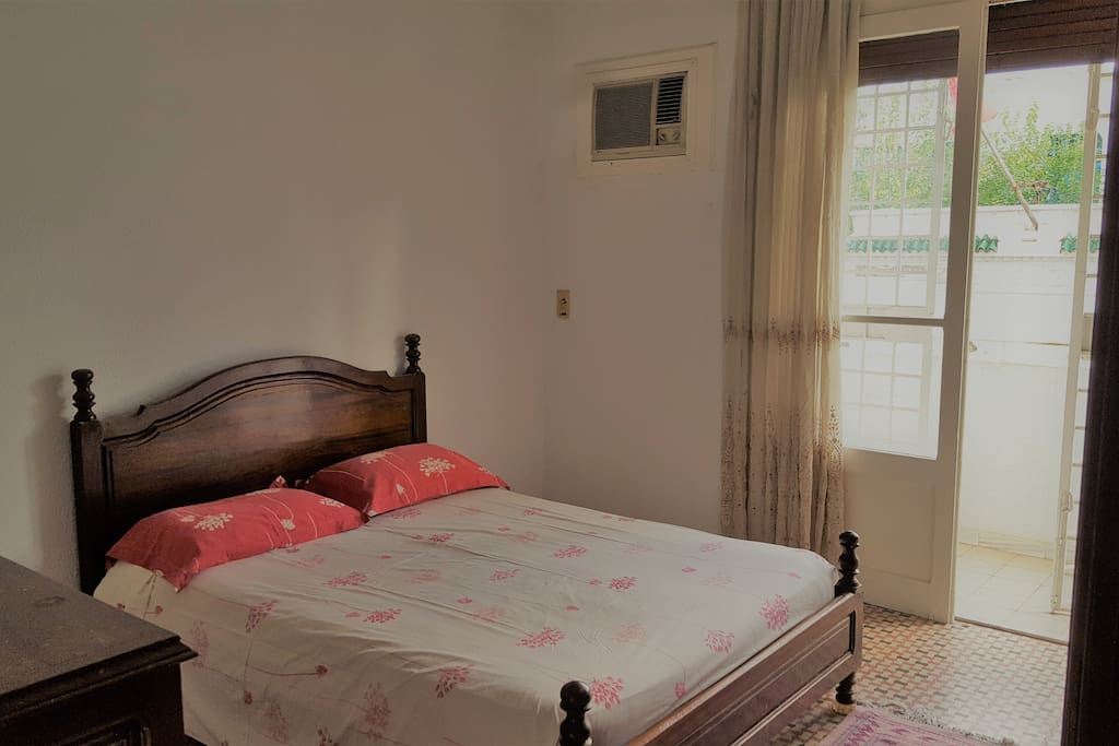 Room 1 with double bed, dressing table and wardrobe