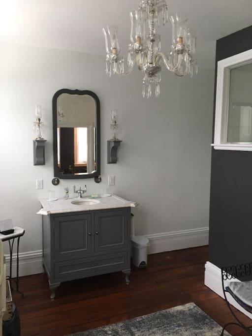 Over sized private bathroom with double shower and closet.