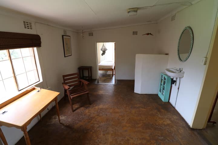 Sitting room leading to single bedroom and shower