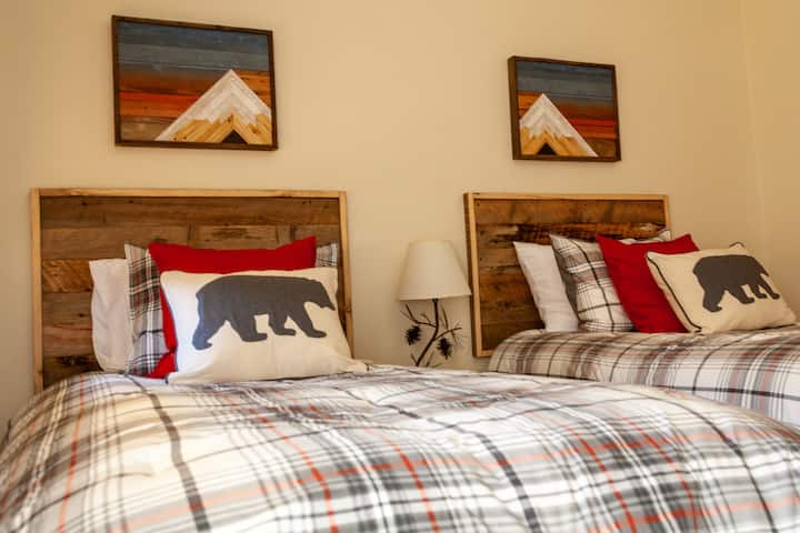 Can't you see yourself sleeping in this room with custom headboards and artwork?