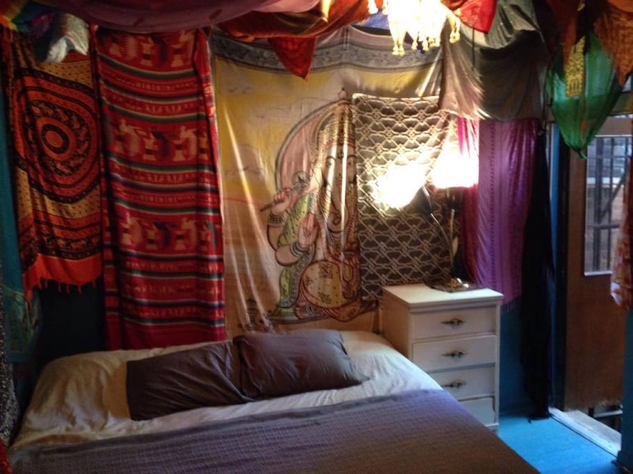King Size bed in bright breezy bedrrom