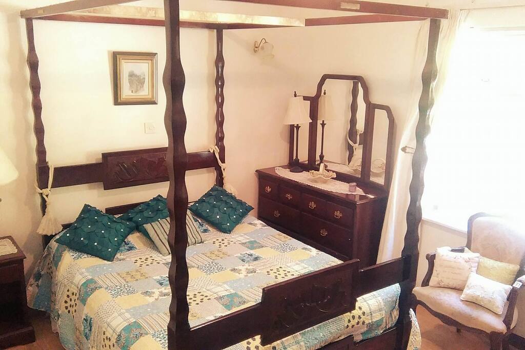 Double Bedroom 1, our cushy four-poster bed which hosts one or two guests and has an en-suite bathroom with shower. Tea/coffee available.