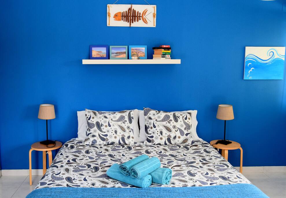 Blue double room with private bathroom and a sofa bed if you need a triple room.
