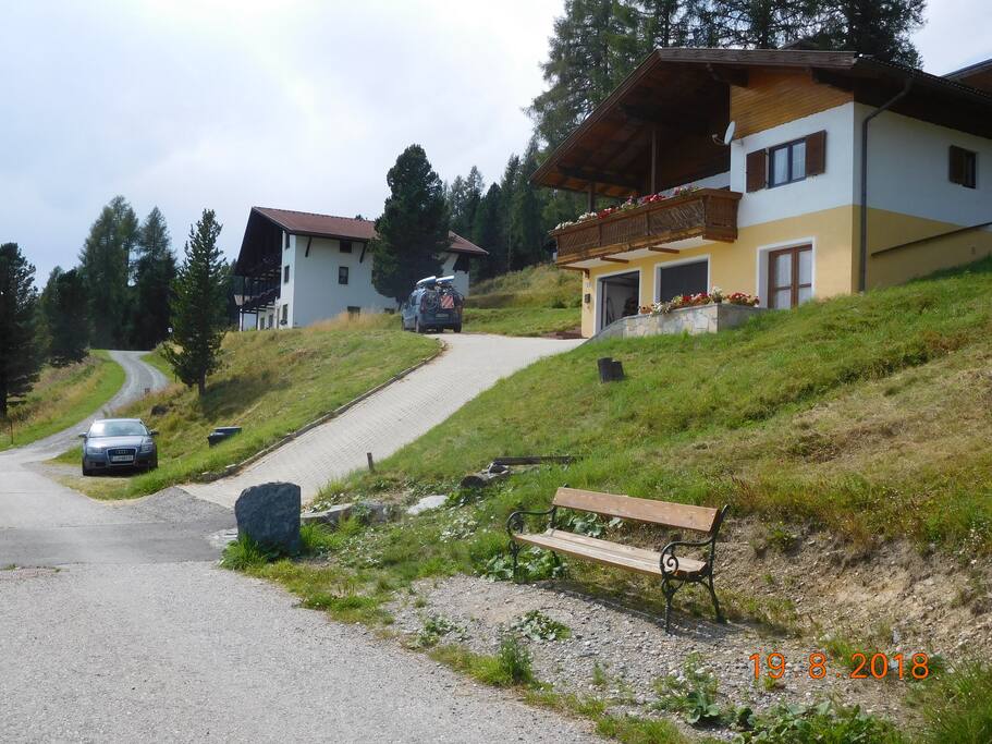 The driveway up to the parking space and garage.