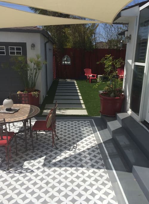 Backyard includes multiple seating areas