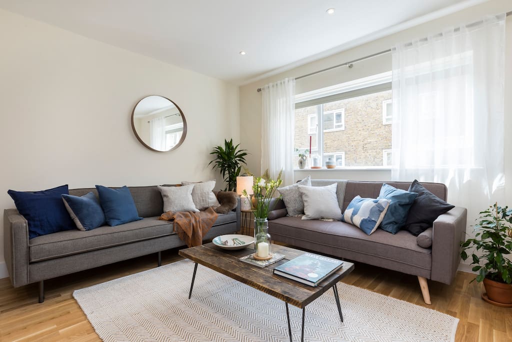 The first floor living area gets lots of light from the large windows.
