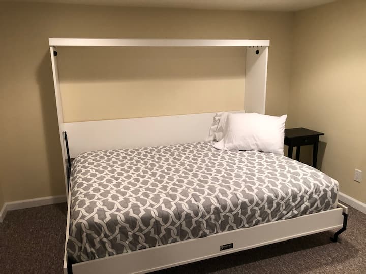 The downstairs room has a firm Murphy Bed that’s very cozy and a great place to destress while watching a movie. 