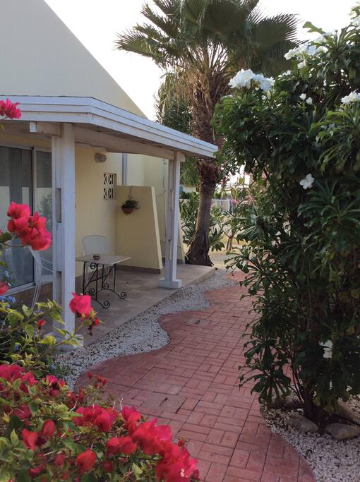 orange apartment patio with chairs and table