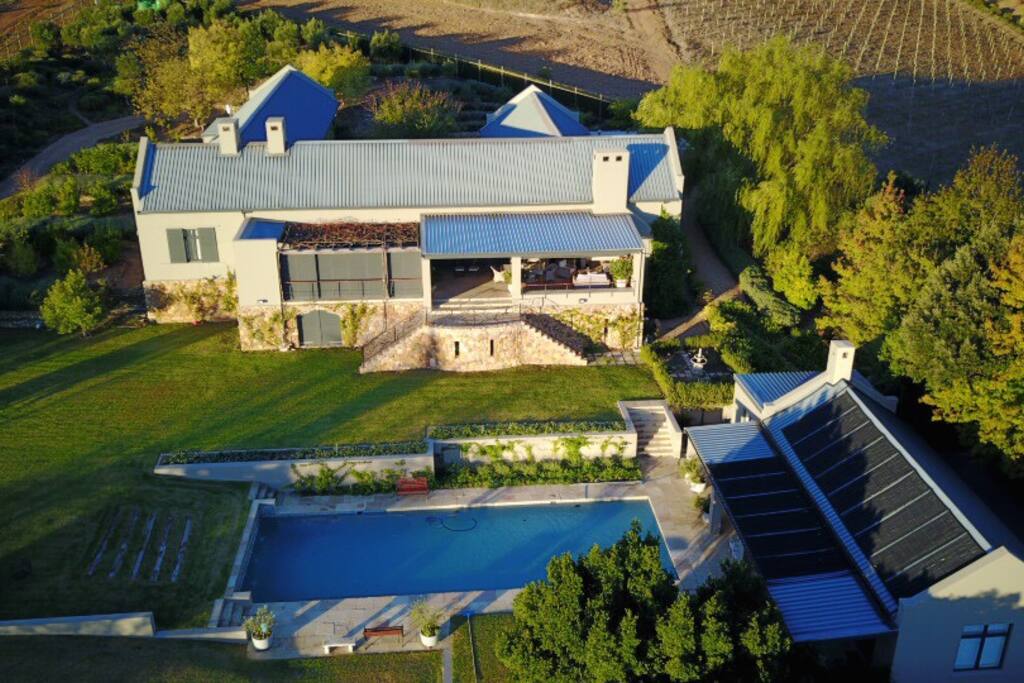 Pool cottage for rental with flow onto large pool