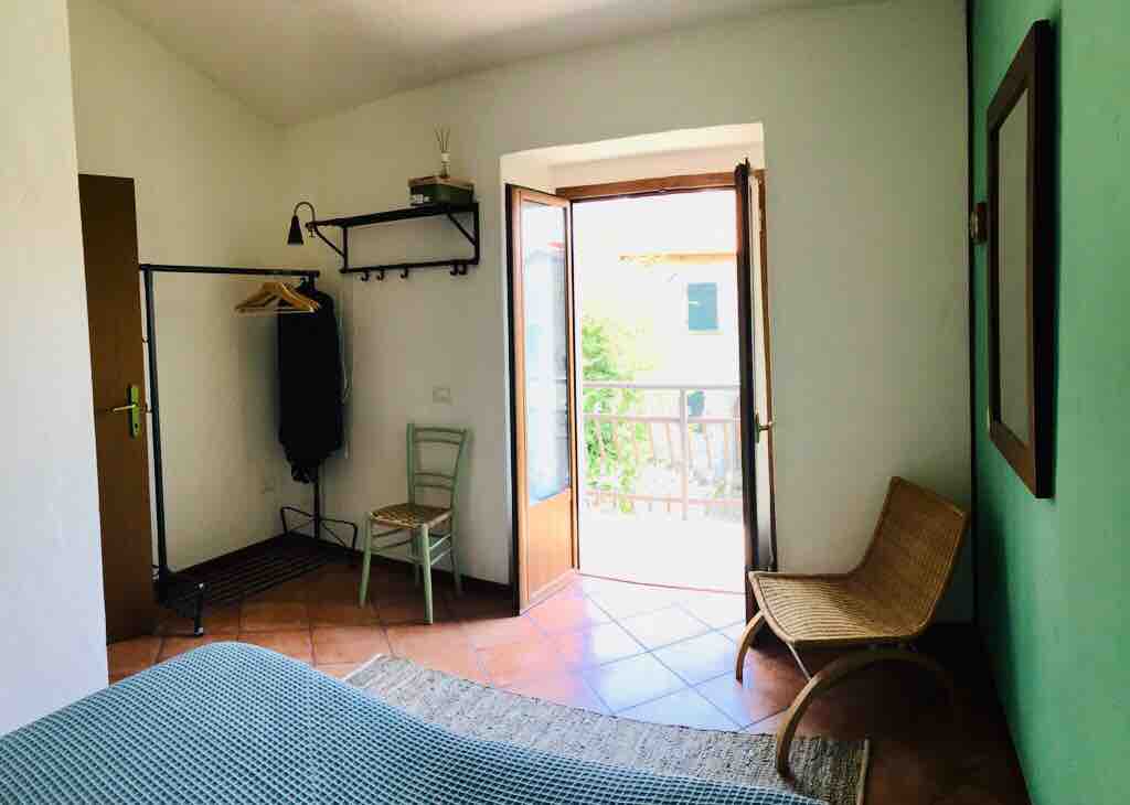 Bedroom with double bed and balcony