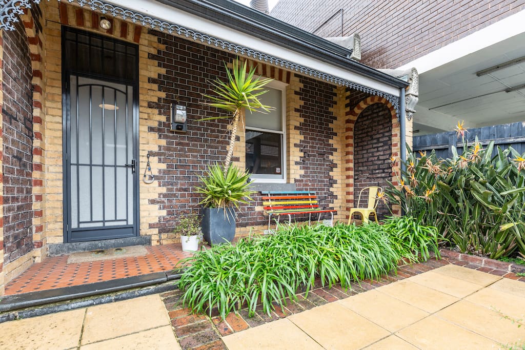 The front patio area of the house is a popular morning coffee spot for many guests with its veiw to the street.