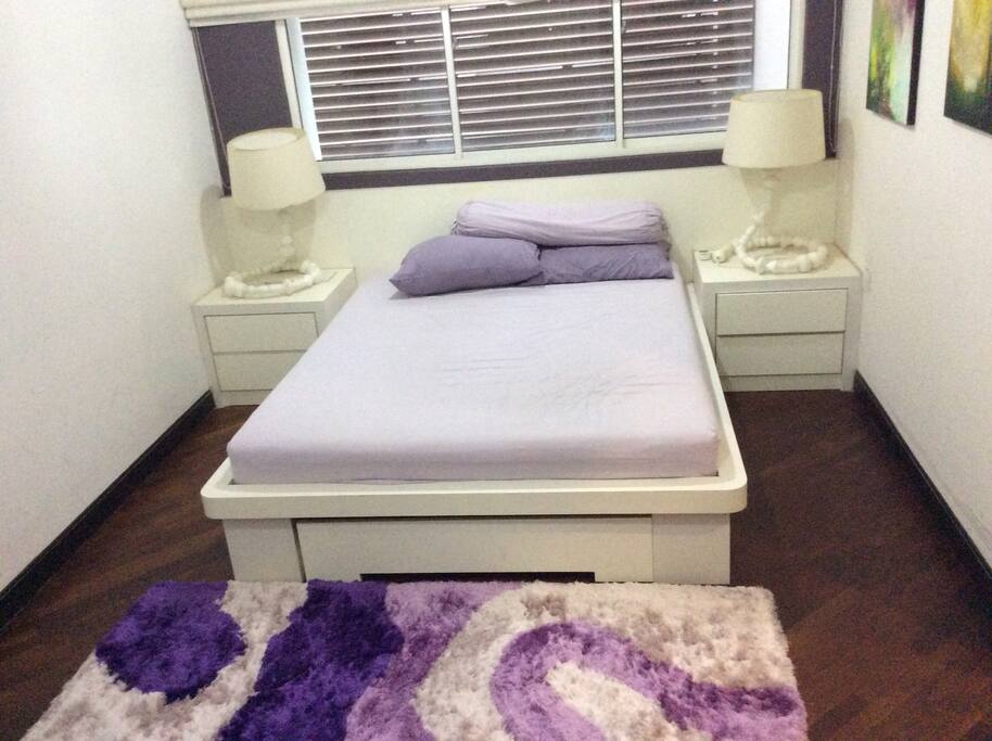 A spacious bedroom accommodating up to 3 pax.