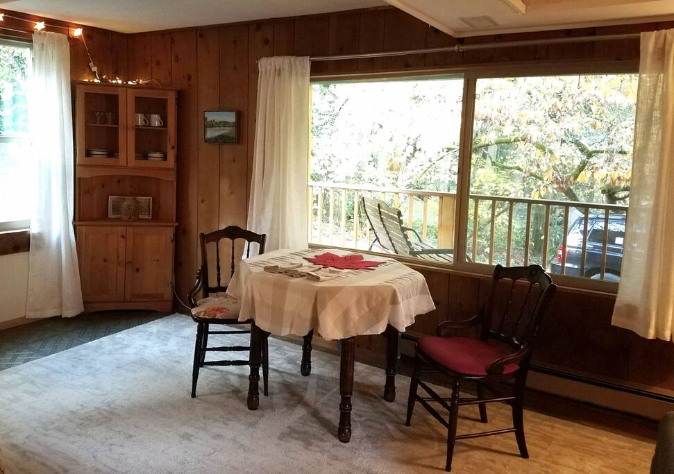 Dining with a view. Durable cotton napkins, dishes, cups and plates are in the corner hutch.