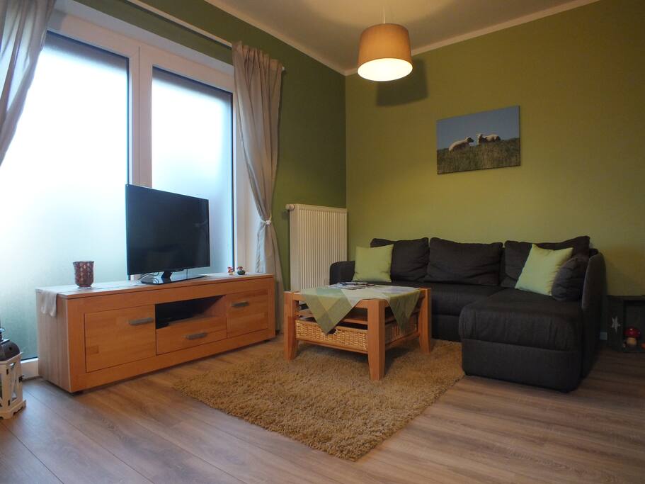 Wohnzimmer mit Schlafcouch für eine fünfte Person