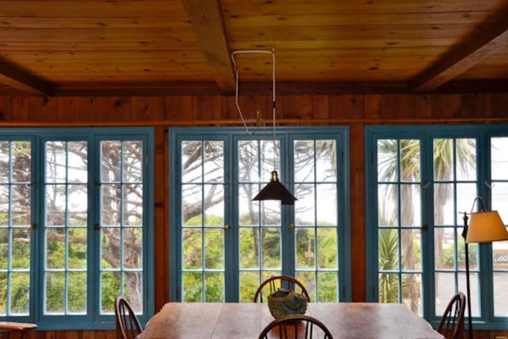 Living room windows looking out toward the ocean.