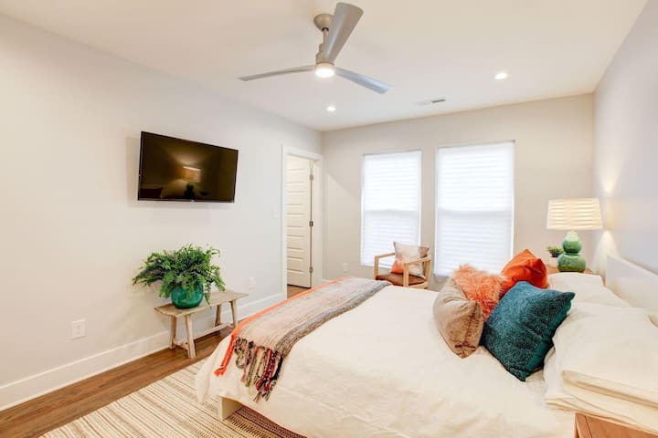 Master bedroom includes a wall mounted TV.