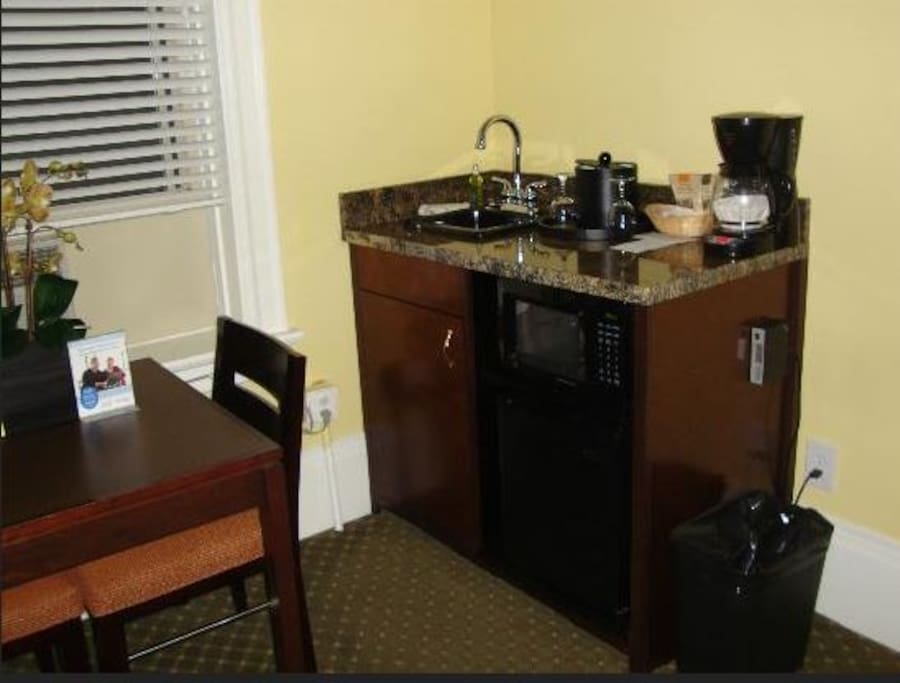 Small mini-fridge/microwave and coffee maker