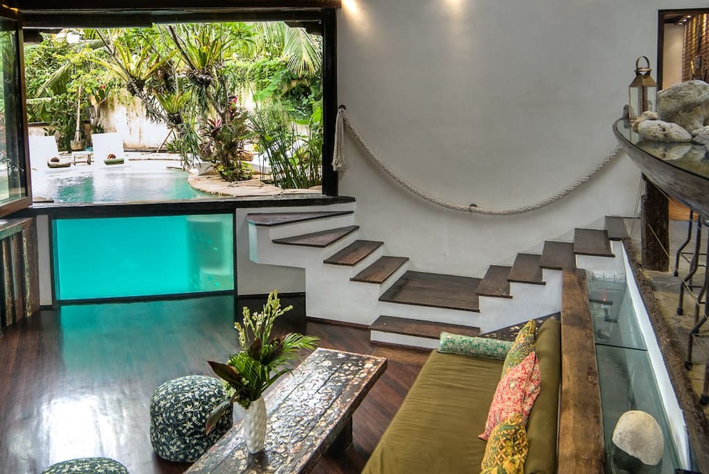 Living room and views into and onto the private pool.