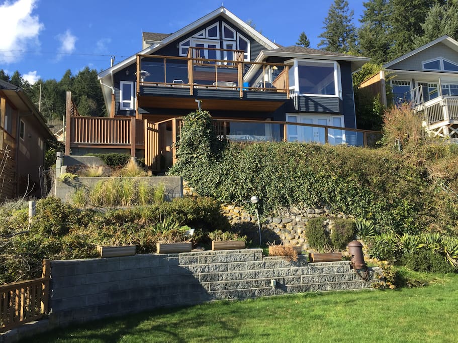Home majestically perched above lovely rock garden