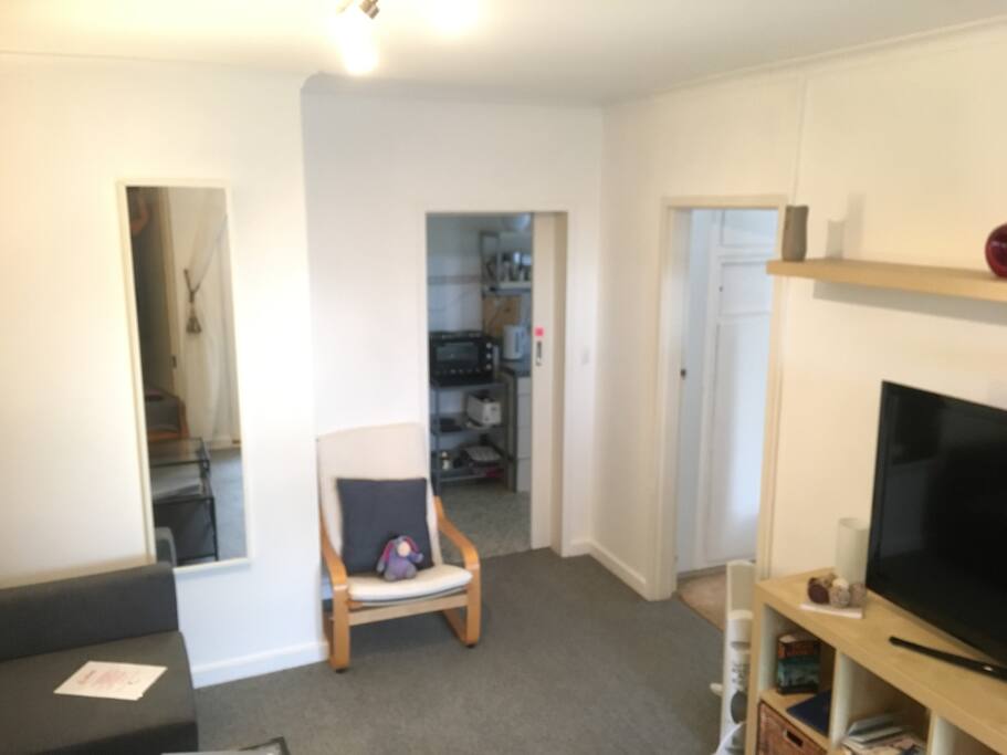 Through to the bedroom and kitchen. Heater and TV.