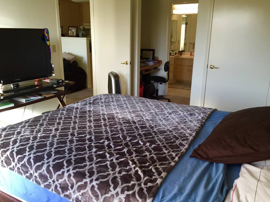 Bedroom with 40" TV and queen size bed