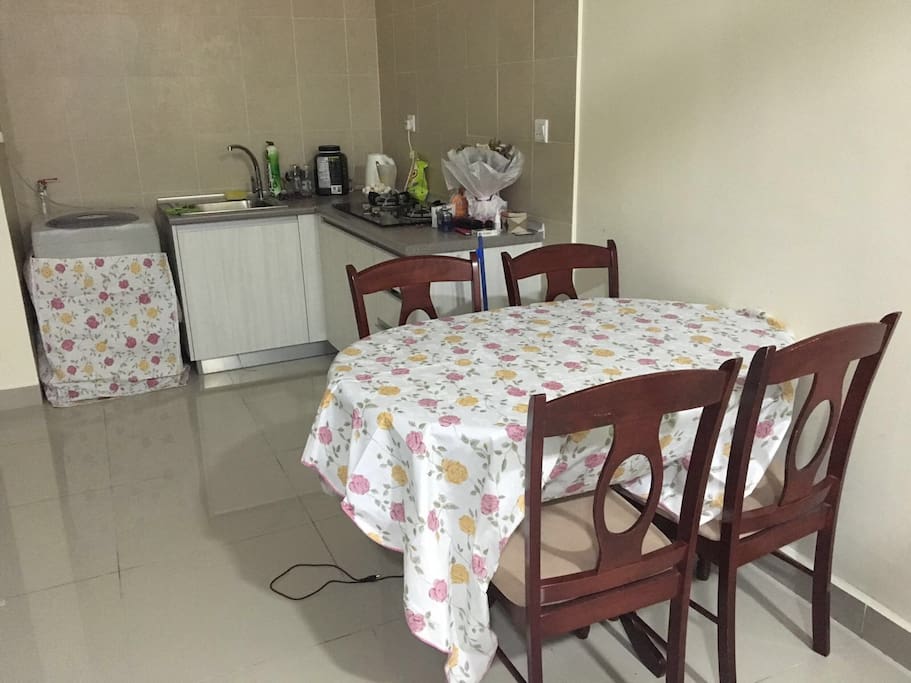 Loveable kitchen with access to fridge, washing machine, and cooking equipments
