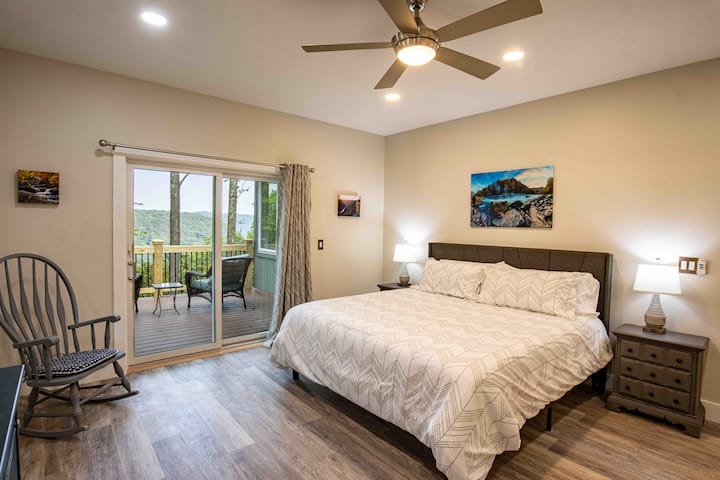 First floor king suite with walk out deck overlooking Gorge and firepit area