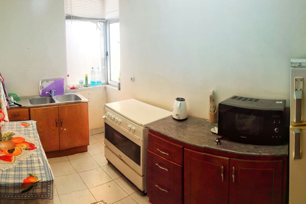 kitchen with stove microwave & refrigerator