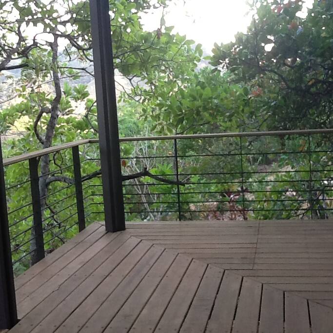 Deck on lower floor bordering the dining and living room.