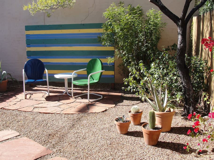 Private, fenced in backyard with desert-landscaping.