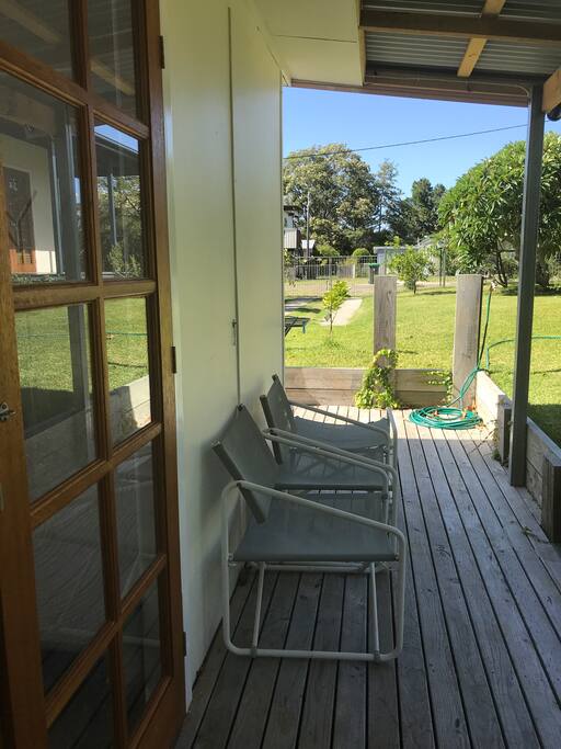 a comfy outdoor sitting area overlooking the garden