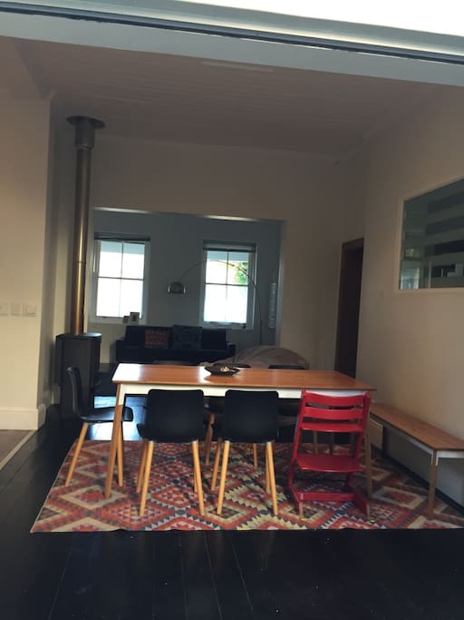 open plan living space next to open plan kitchen
