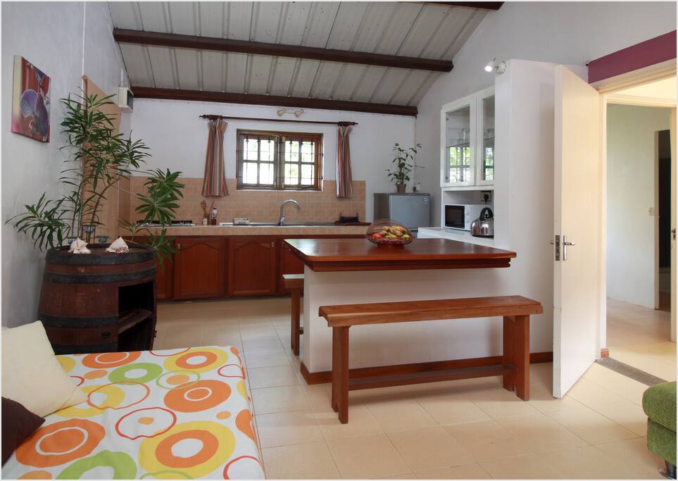 The Lounge room with its single bed annex to the kitchen.