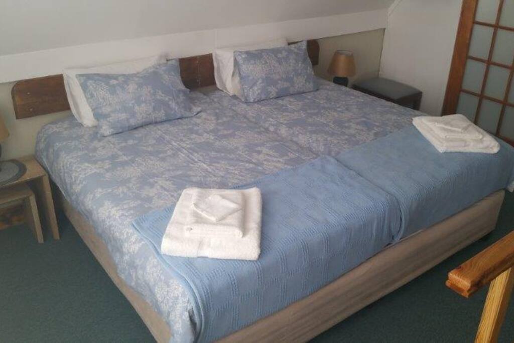 The king size bed is made up of two 3/4 beds on the mezzanine level.