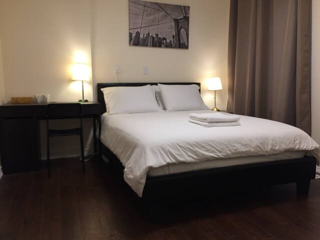 One queen bed with a private bathroom by subway