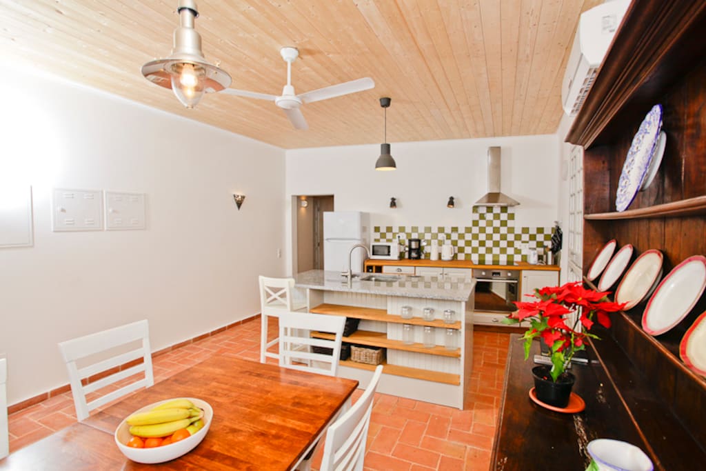 Kitchen dining room with air conditioning and ceiling fan