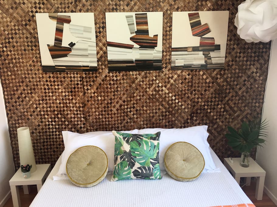 Private Guest Room View of Bed and Mid Century Modern Artwork
