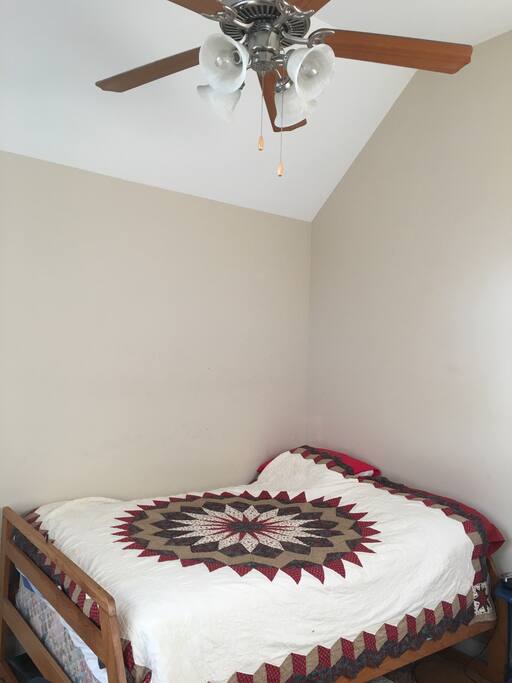 High ceiling with ceiling fan.