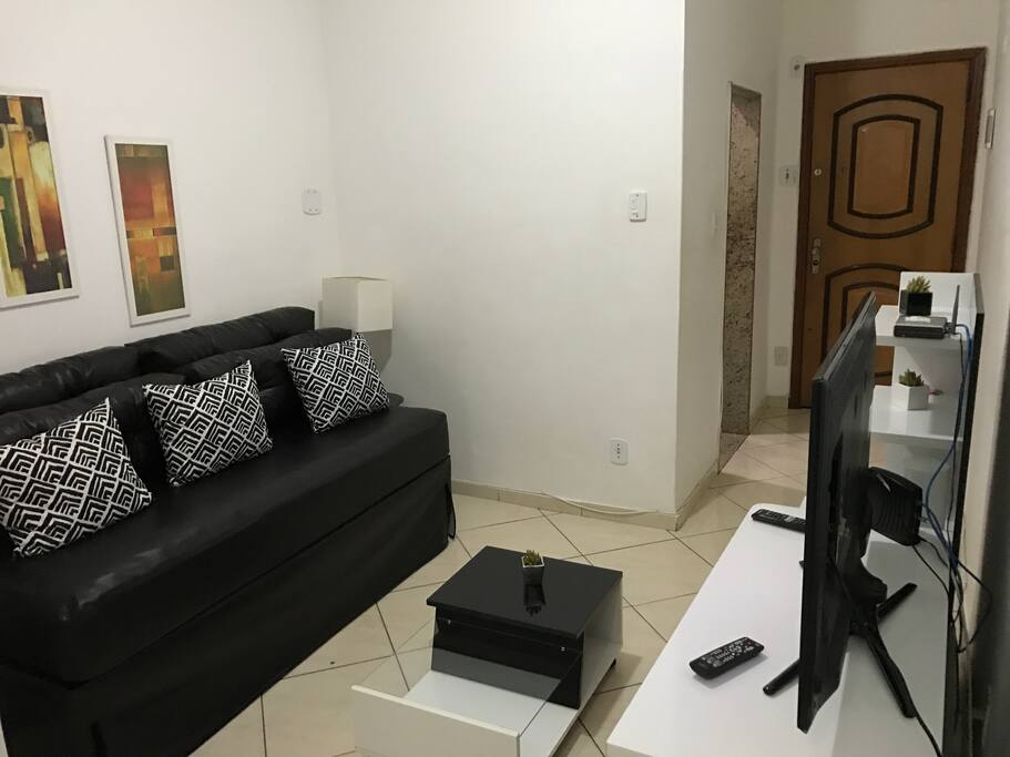 Sala com sofá bicama