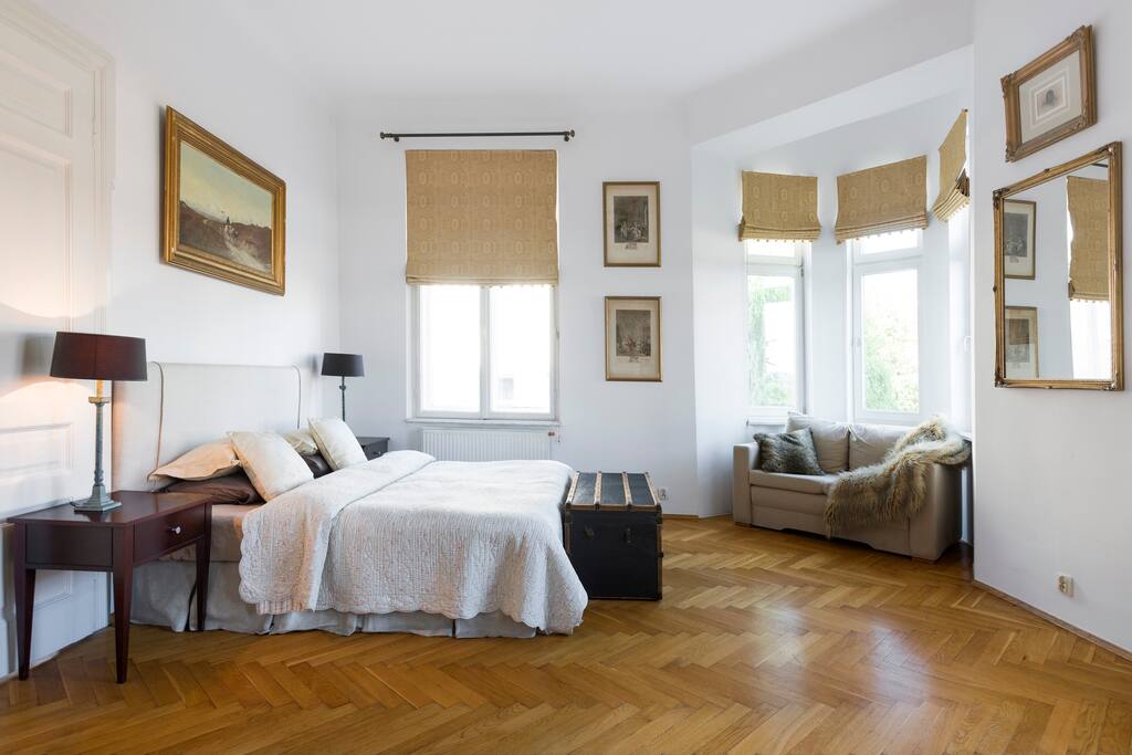 Master bedroom with King bed. Single sofa bed in corner.