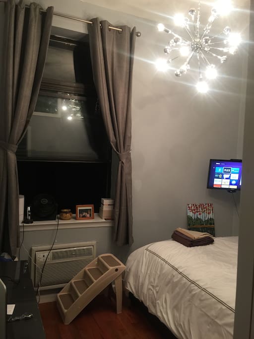 bedroom, dimmer on full blast. Queen Bed